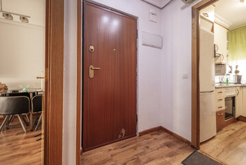 Hall of a house with armored door and access to other rooms