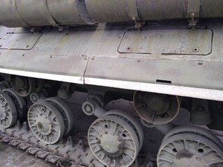 Military equipment, a close-up battle tank on a tracked track