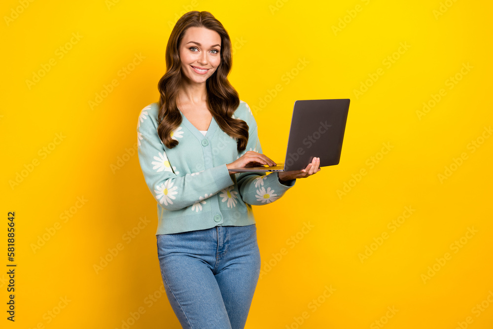 Wall mural Photo of pretty cheerful lady hold use wireless netbook write email isolated on yellow color background - Wall murals