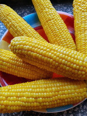 Boiled juicy corn on a plate