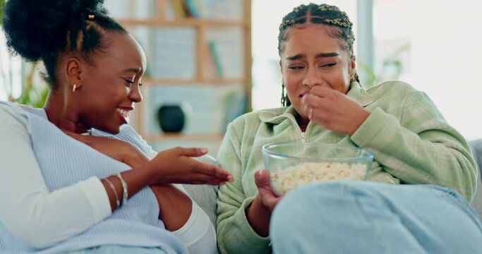 Women Friends, Horror Movie And Popcorn On Home Sofa While Scared And Terrified Together For Bonding. Black Female People Watching Or Streaming Scary Film On Couch To Relax With A Snack And Fear