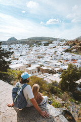 Greece family vacations man with child sightseeing Lindos city aerial view travel lifestyle summer...