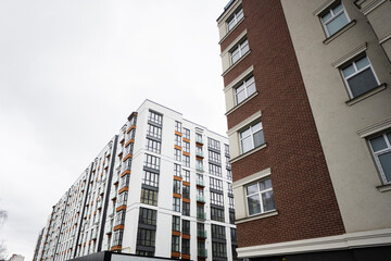 Modern residential multistory apartment buildings. Facade of new houses.