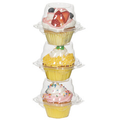 Stack of plastic containers with cupcakes in side isolated