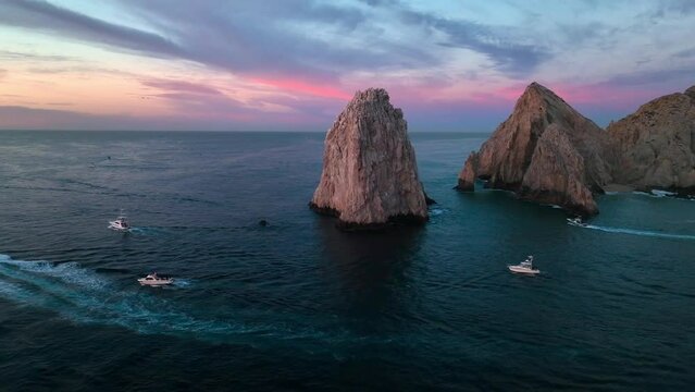 Pink sky pre sunrise view of El Arco Cabo San Lucas Arch, Los Cabos Mexico.