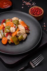 Delicious chicken slices and steamed vegetables carrots, broccoli, asparagus beans