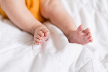 Obraz na płótnie Canvas baby's legs close-up, space for text