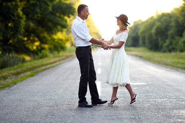 couple in love walking on the road