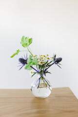 Flowers in a glass vase on a table