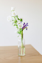 Flowers in a glass vase on a table
