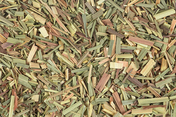 Aromatic dried lemongrass as background, top view.