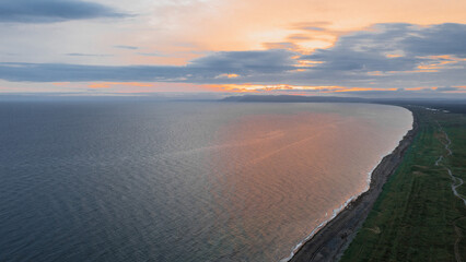 Aniva Bay overlooking Japan from the Russian island of Sakhalin. Beautiful sunset on the sea.