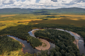 Bizarre bends of the Siberian mountain river on Sakhalin! Picturesque hills and dense taiga forest...