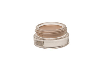 A brow pomade in blonde shade with brush isolated on a white background.