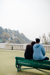 couple sitting on bench