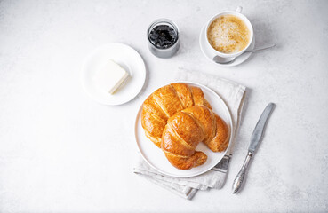 Fresh croissants in a plate for breakfast