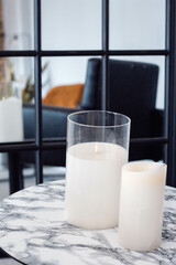 White Stylish Candles on the Table Aesthetics Composition.