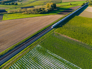 Aerial view of an ICE express train between fields in the countryside