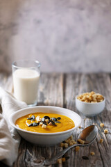 vegan pumpkin soup on a wooden table