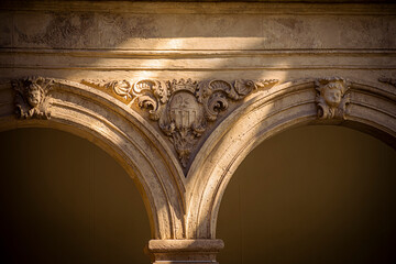Detail of a semicircular arch in the cloister of a Renaissance palace in Lorca, Murcia, Spain, in...