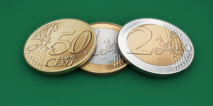 euro coins isolated on green background