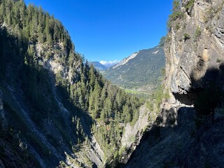 Fototapeta na wymiar View towards the picturesque valley of the river Albula or Alvra from the canyon of the alpine stream Schaftobelbach, Alvaneu Bad (Alvagni Bogn) - Canton of Grisons, Switzerland (Schweiz)