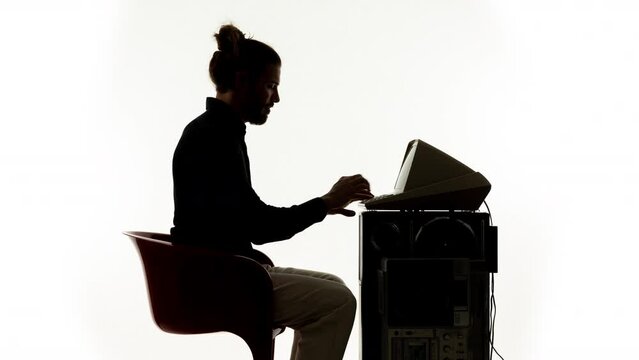 Young man working on a vintage compute