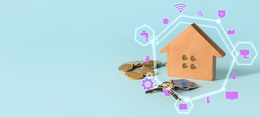 Obraz na płótnie Canvas Wooden house with key and coins on light blue background with space for text. Concept of smart home