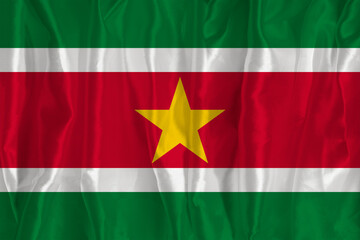 The flag of Suriname on a silk background is a great national symbol. Texture of fabrics The...