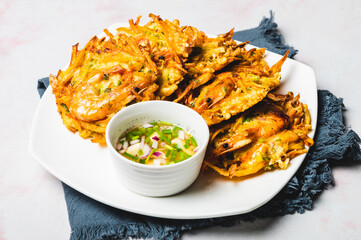 Okoy –Filipino-style shrimp and vegetable fritter usually eaten as a simple appetizer or quick snack.