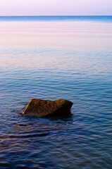 coastal stones on the sea beach at dawn