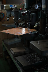 Part machining with drilling machine