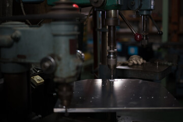 Part machining with drilling machine