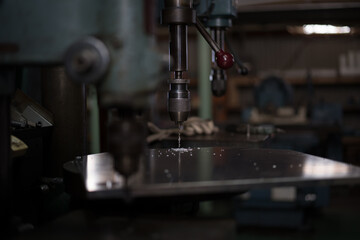 Part machining with drilling machine