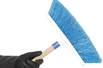 An isolated hand in a black rubber glove holding a broom on a white background. Hand of a cleaner.