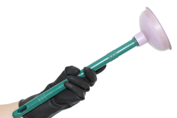 An isolated hand in a black rubber glove holding a plunger on a white background. Hand of a cleaner.