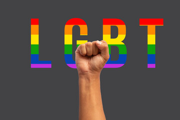 fist up with clenched hand with the word lgbt