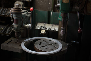 Part machining with drilling machine