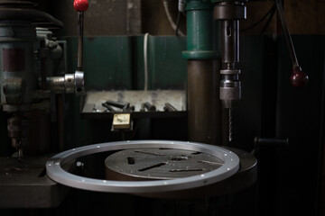 Part machining with drilling machine