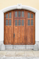 View of city building with old wooden door