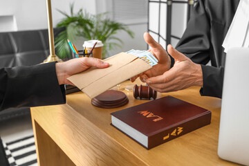 Man giving bribe to judge in courtroom, closeup