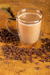 Glass cup, glass cup with milk and coffee on rustic wood, selective focus.
