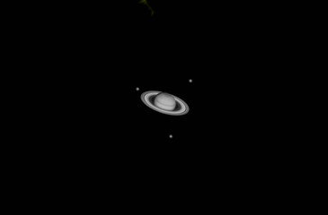 planet saturn seen through a telescope © Marco
