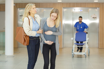 pregnant woman arriving at the maternity hospital in pain