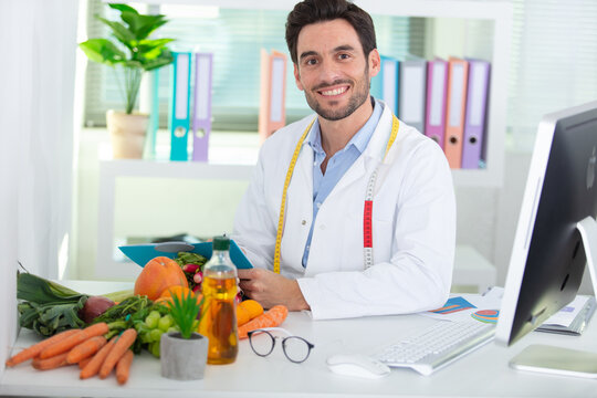portrait of male nutritionist in his office