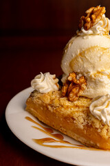 Piece of yummy lemon meringue pie on wooden table