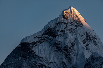 Ama Dablam (6812m): Tip of Ama Dablam being gently touched by last rays of the light. See ya tomorrow... Photo taken from the village of Dzonghla