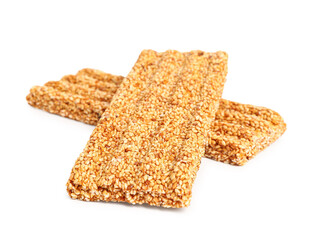 Sweet sesame kozinaki bars on white background
