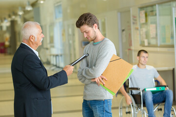 teacher and student talking in corridor