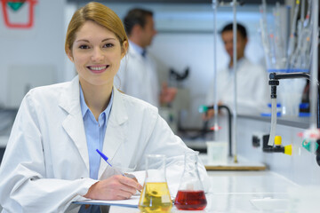 happy positive woman doing a microbiological research